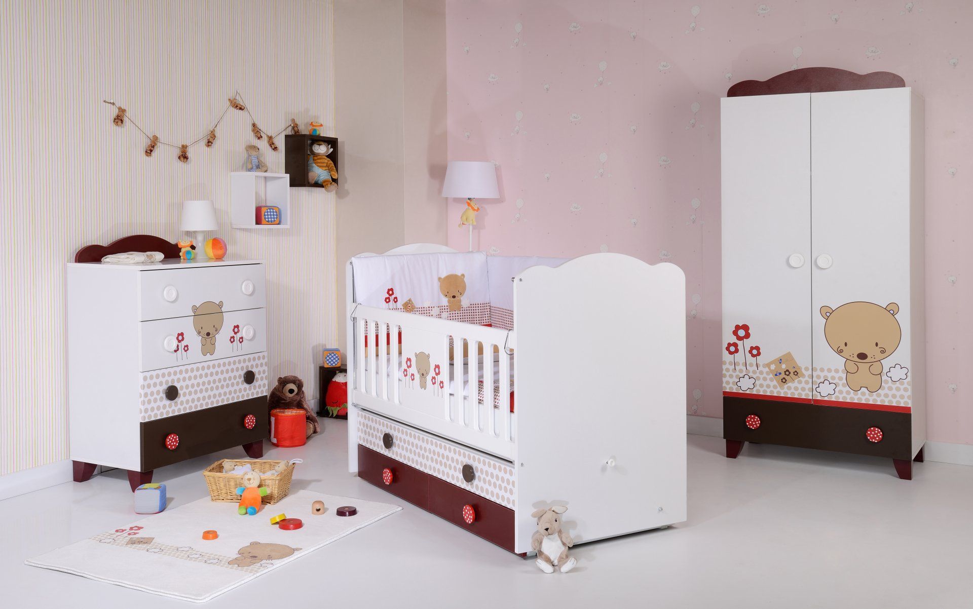 A baby room with a crib , dresser , and wardrobe.