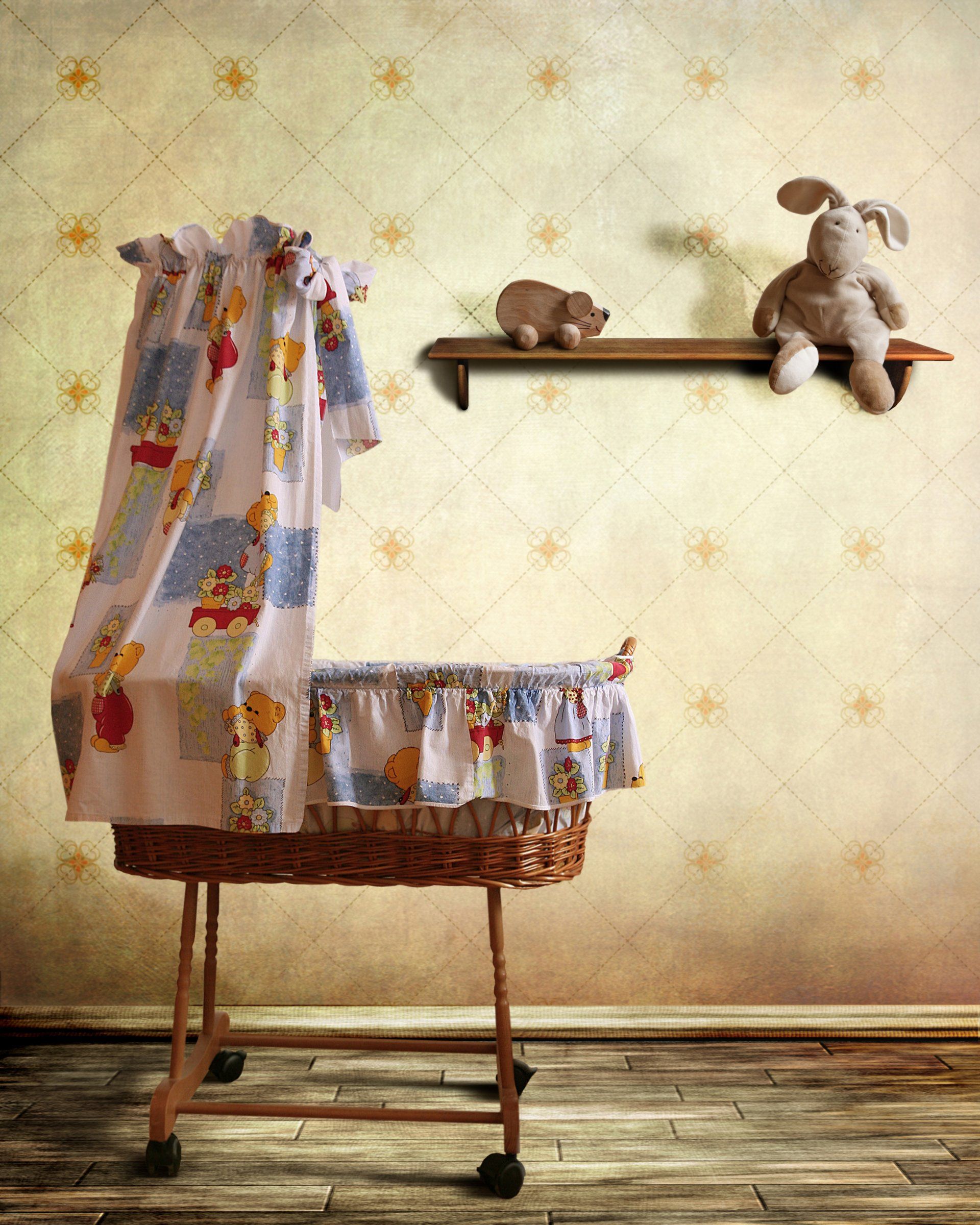 A baby room with a wicker crib and a shelf with stuffed animals on it