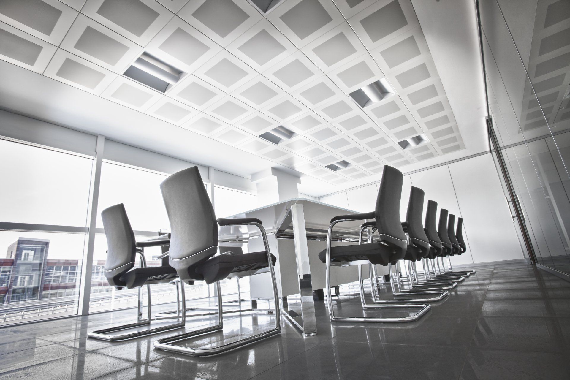 A conference room with a long table and chairs