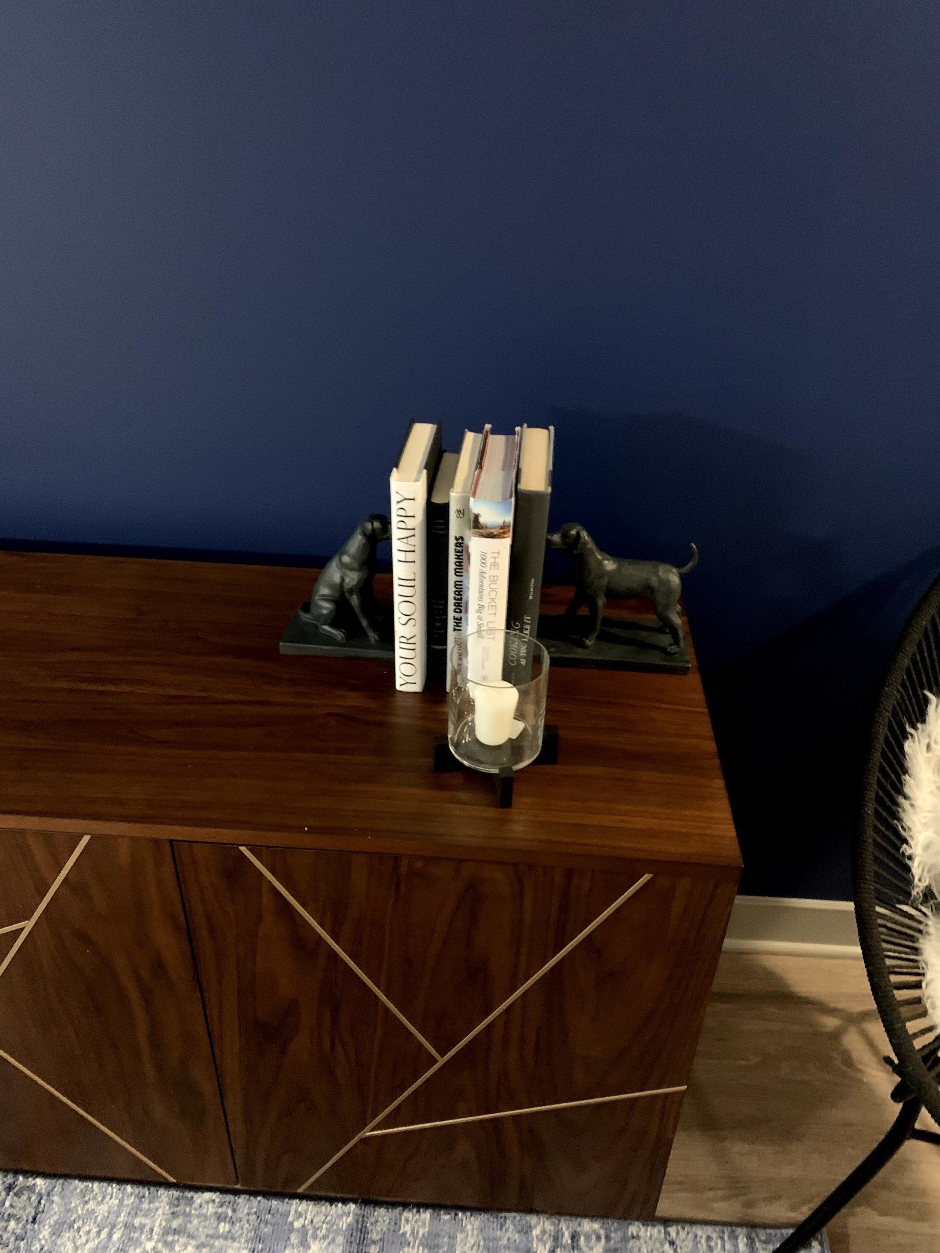 A couple of books sitting on top of a wooden table