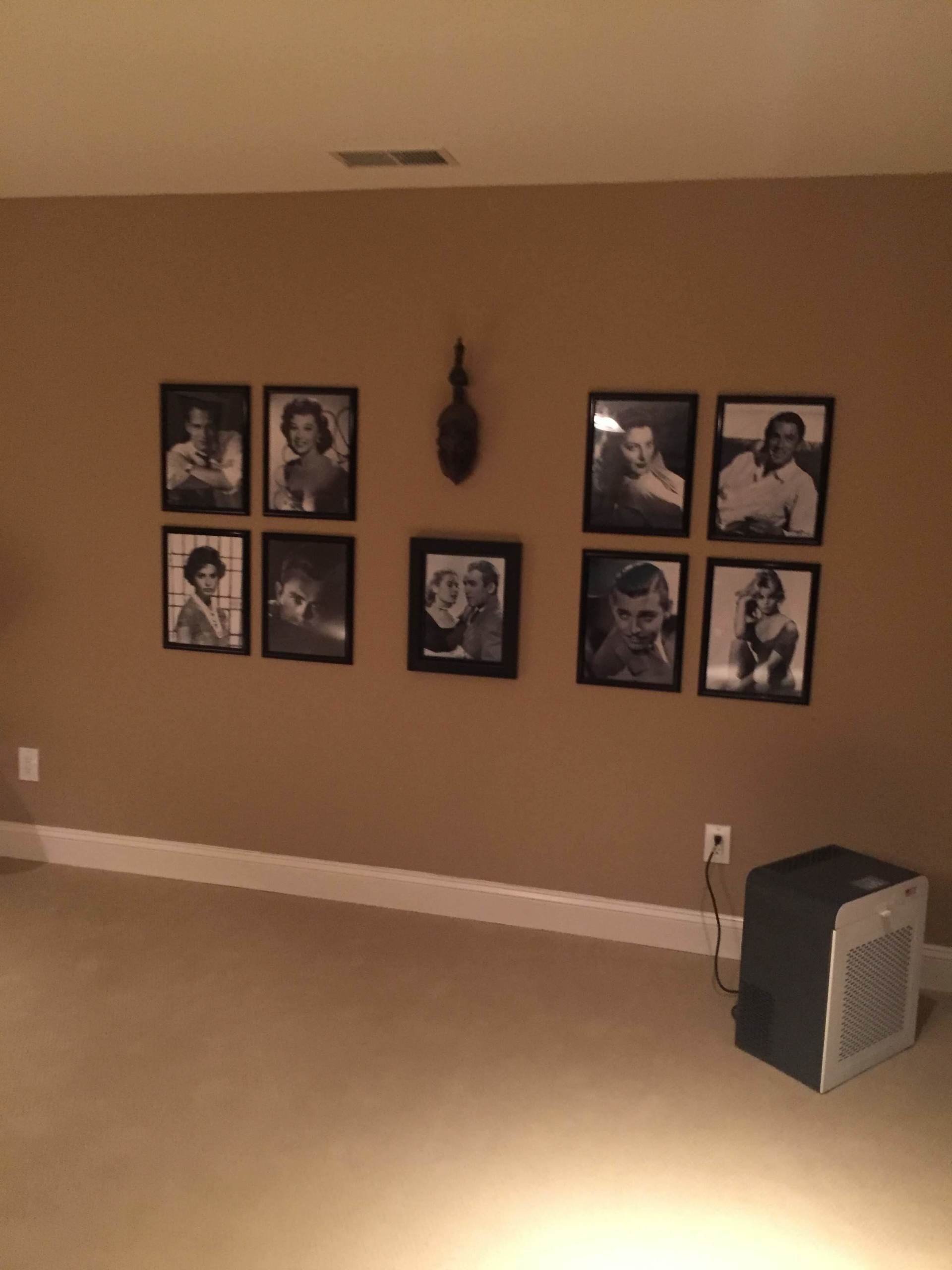 A room with a lot of pictures on the wall