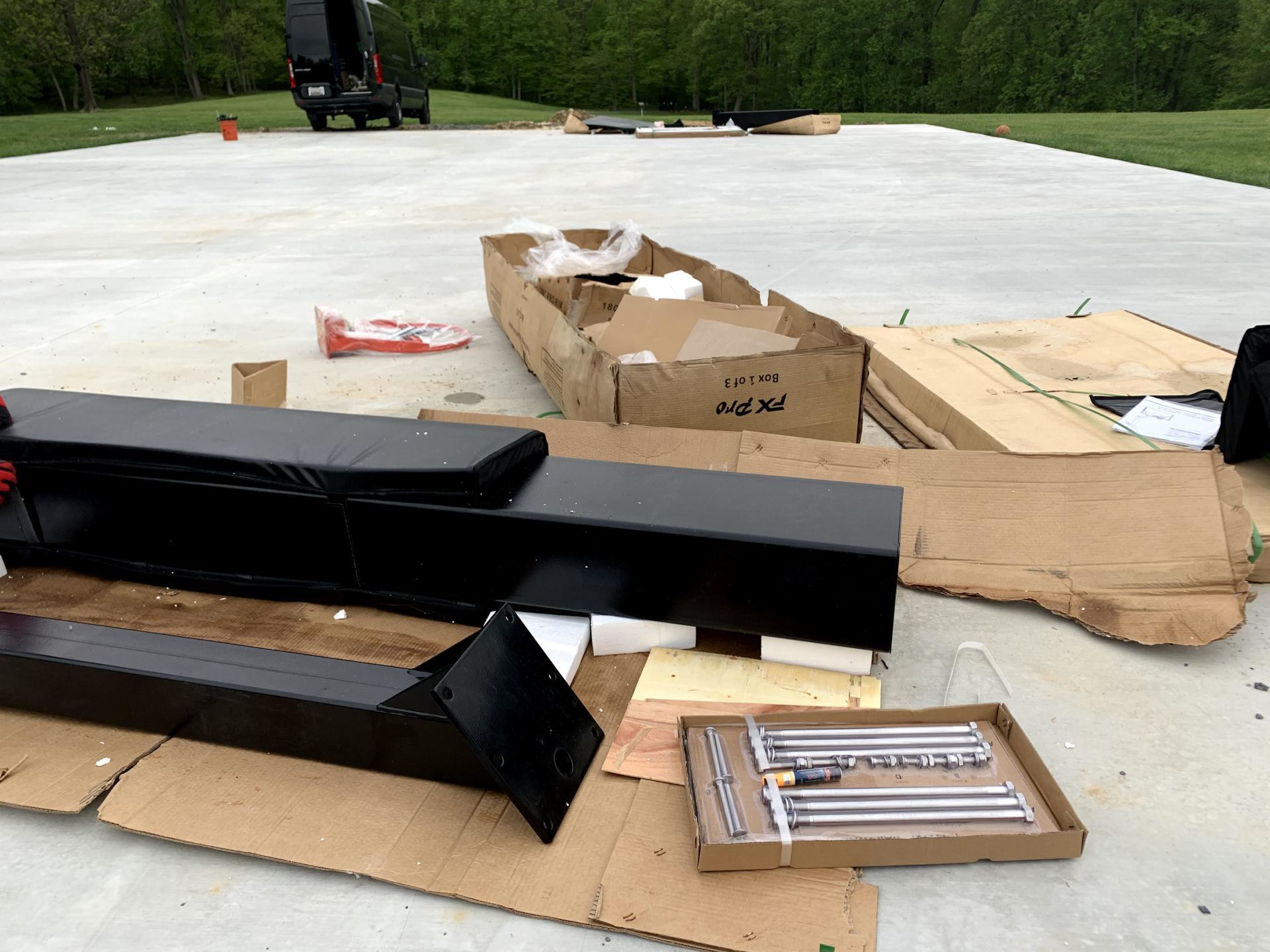 A bunch of cardboard boxes are laying on the ground