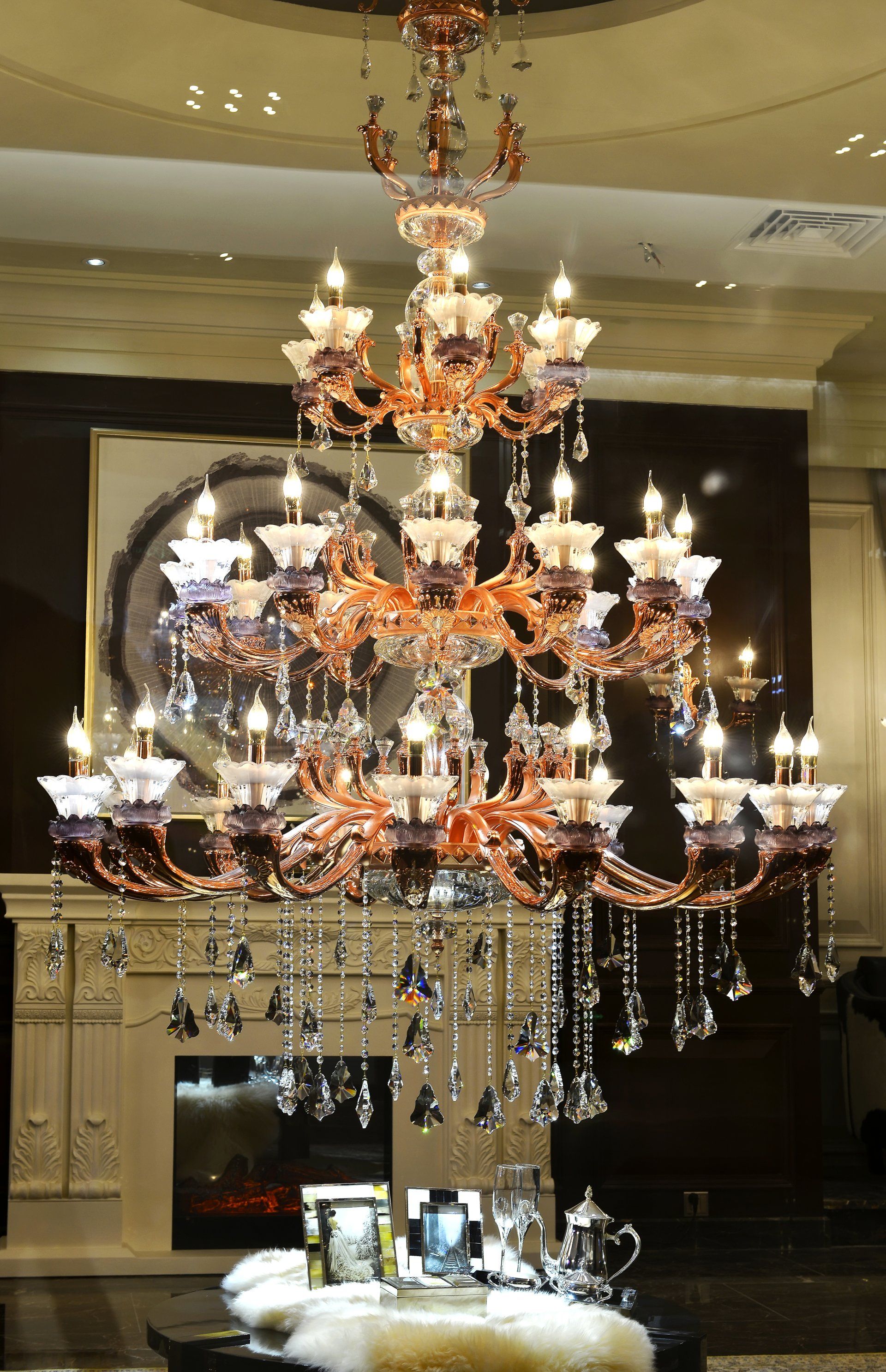 A large chandelier is hanging from the ceiling in a living room