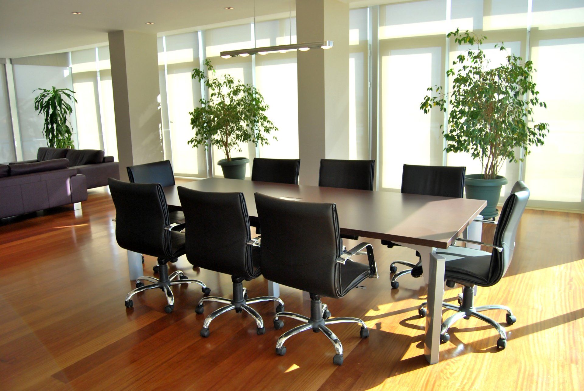 A conference room with a long table and chairs