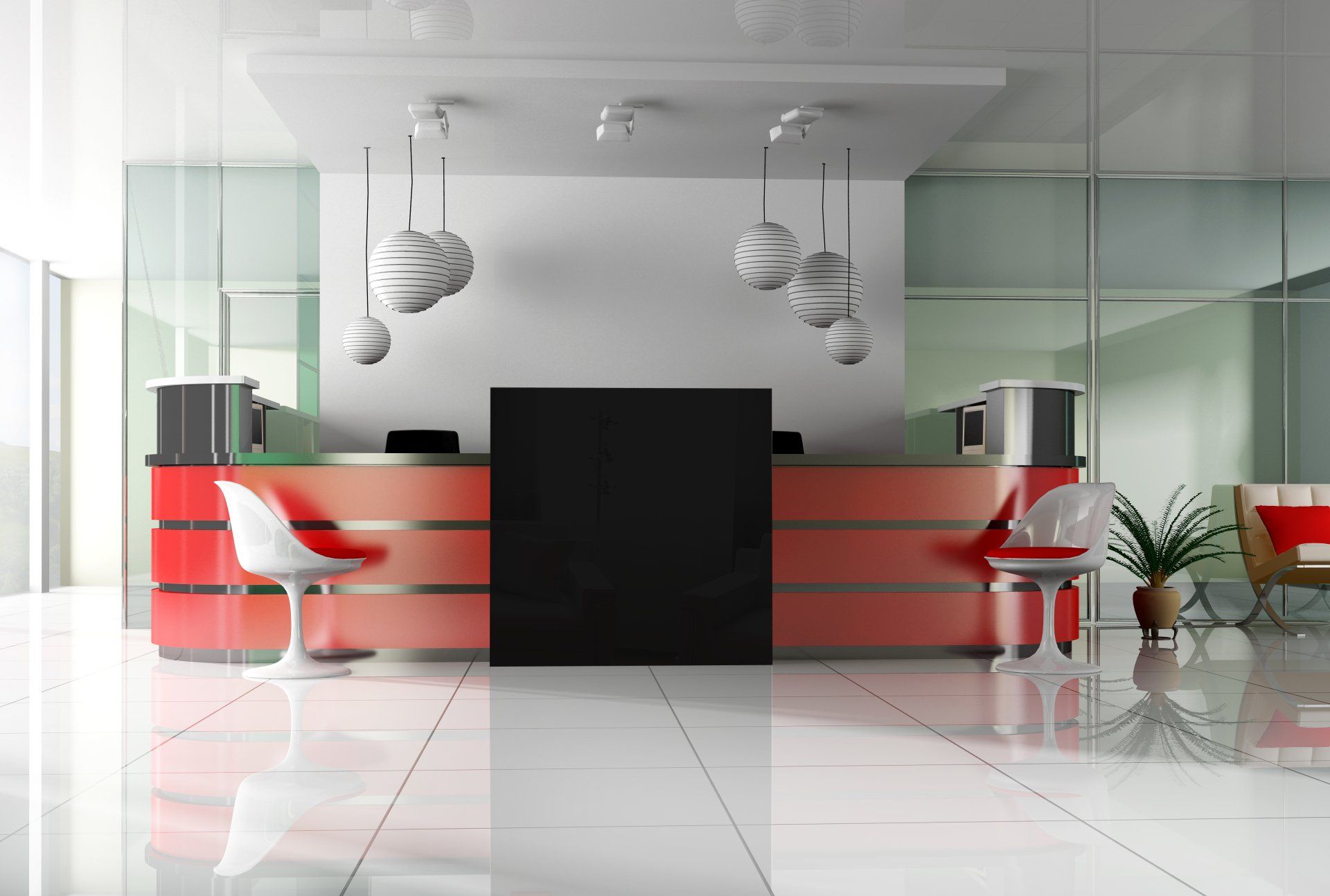 A reception area with a red counter and chairs