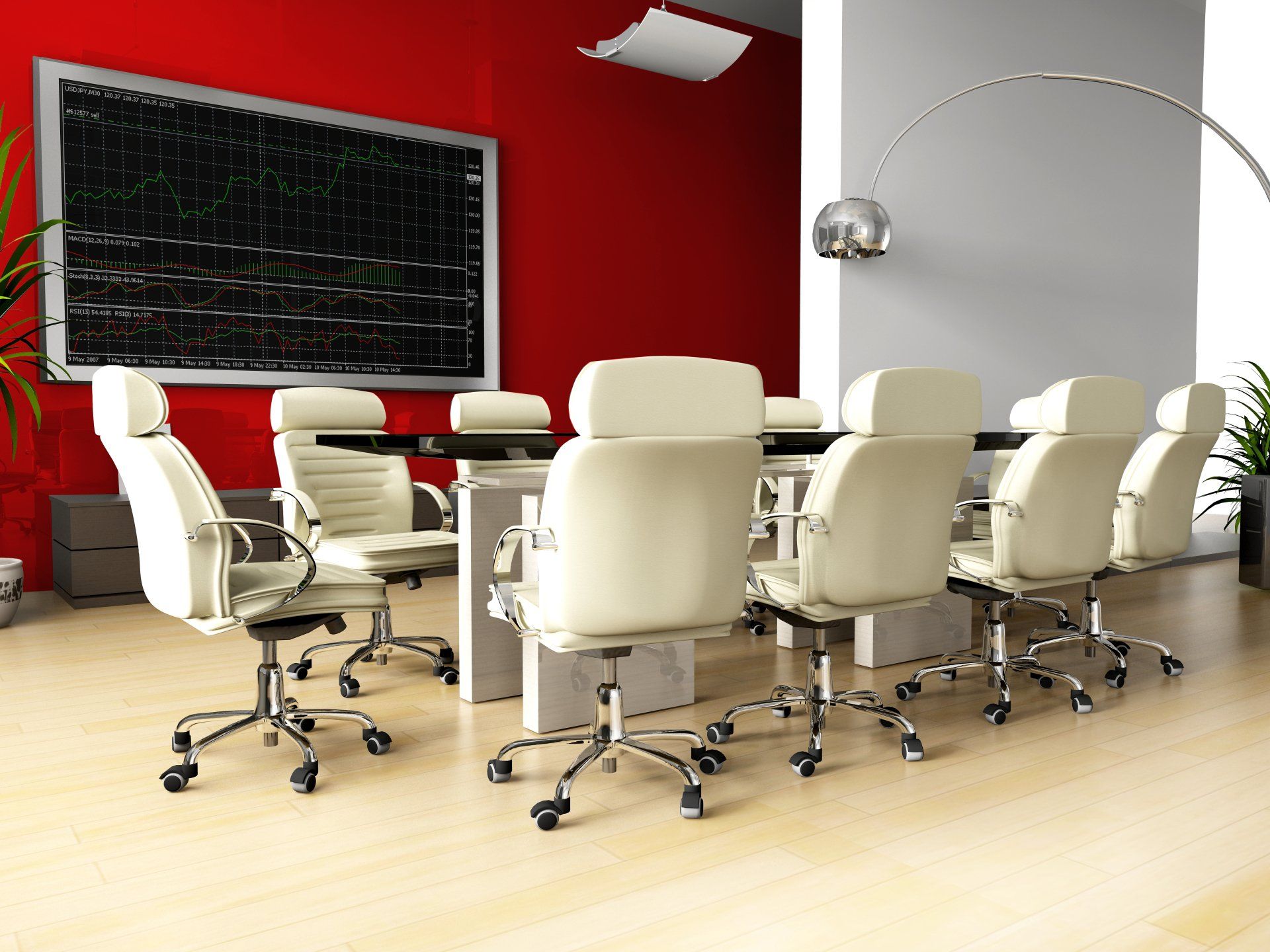 A conference room with red walls and white chairs