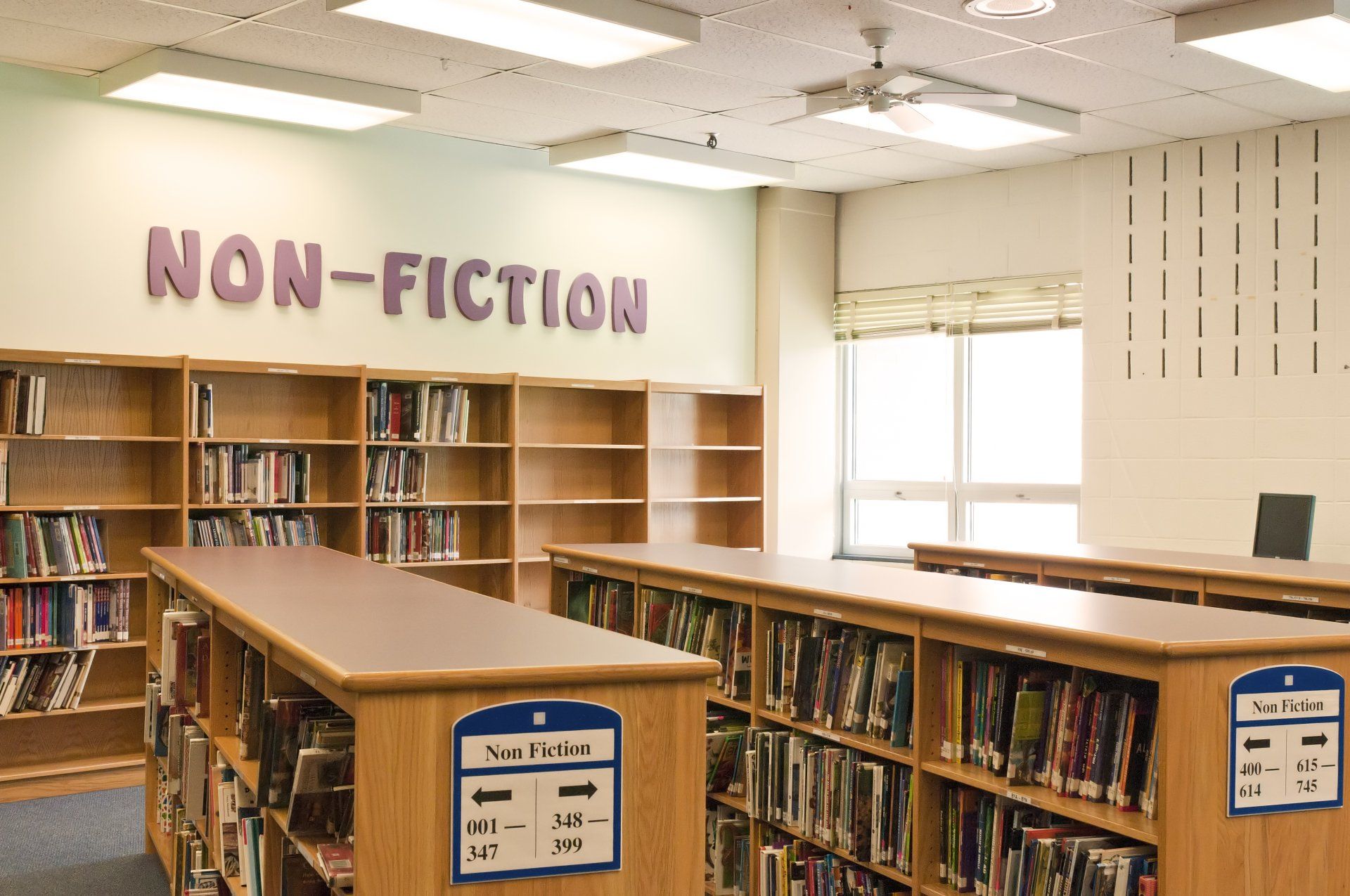 A library with a sign that says non-fiction