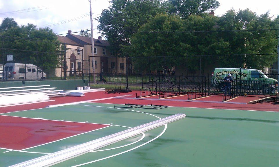 A basketball court is being built in a park