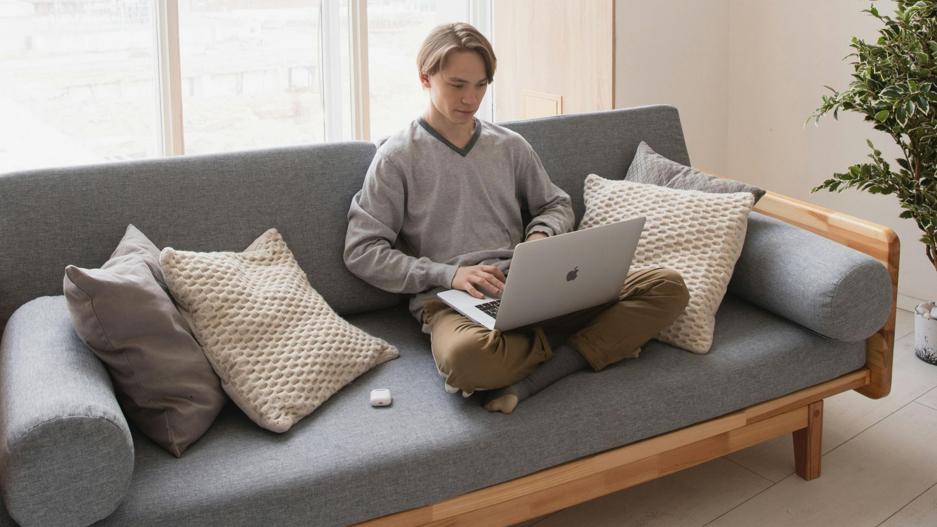 Modern living room featuring smart sectional sofa with wireless charging