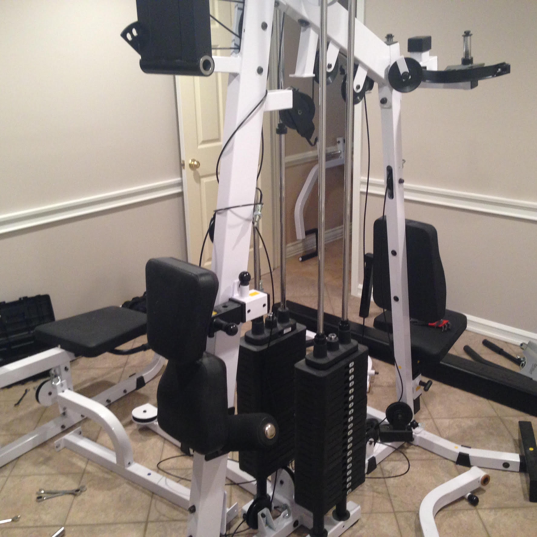 A white and black exercise machine in a room