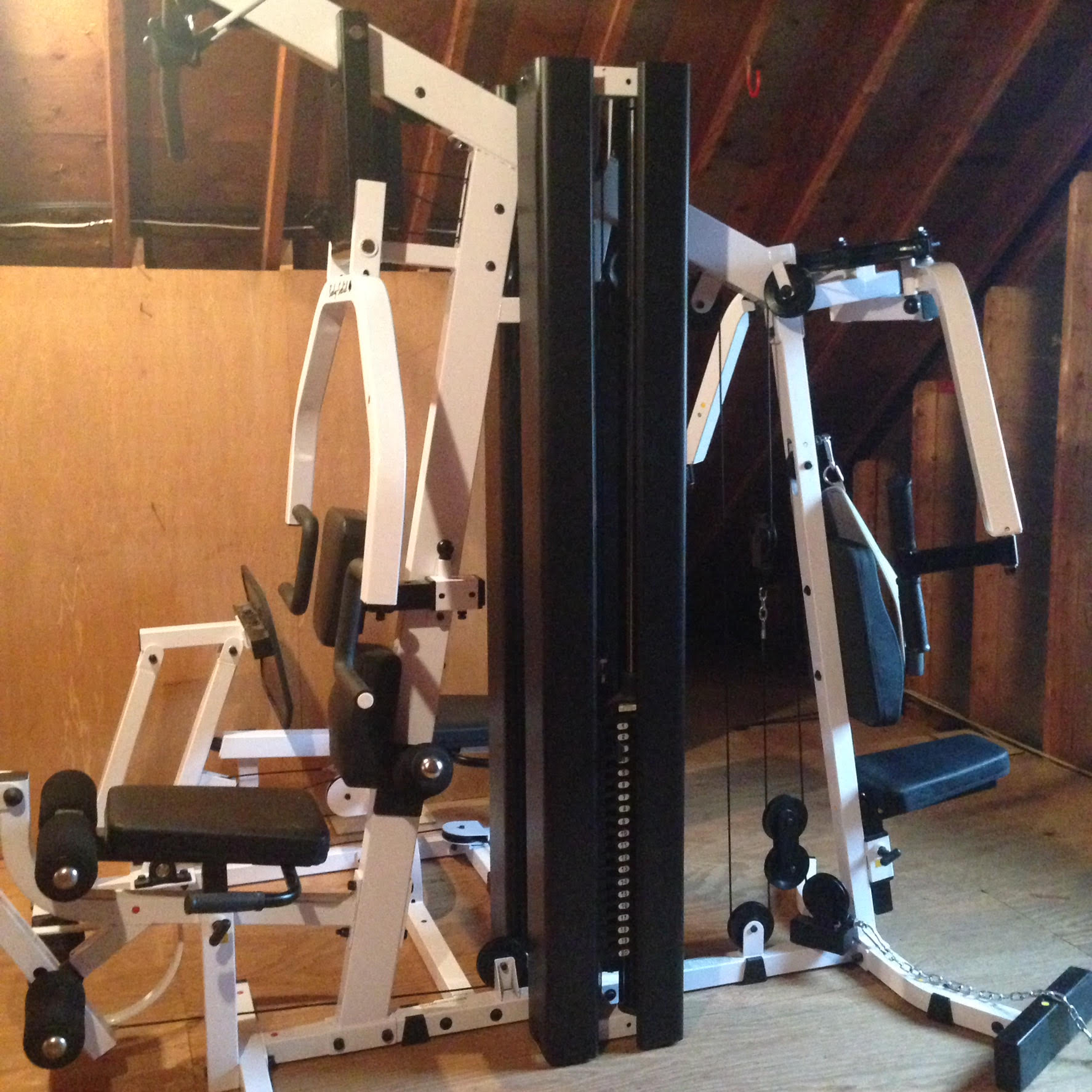 A black and white exercise machine in a room