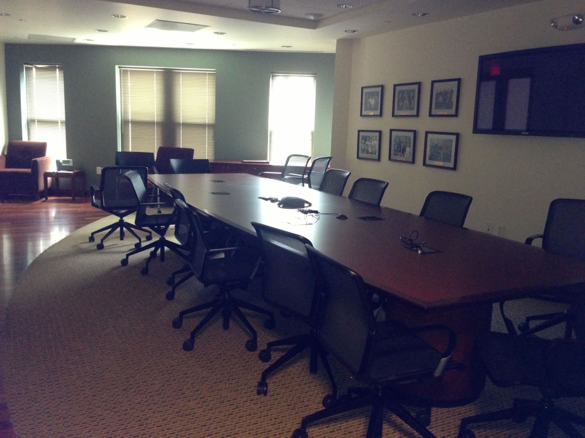 A conference room with a long table and chairs