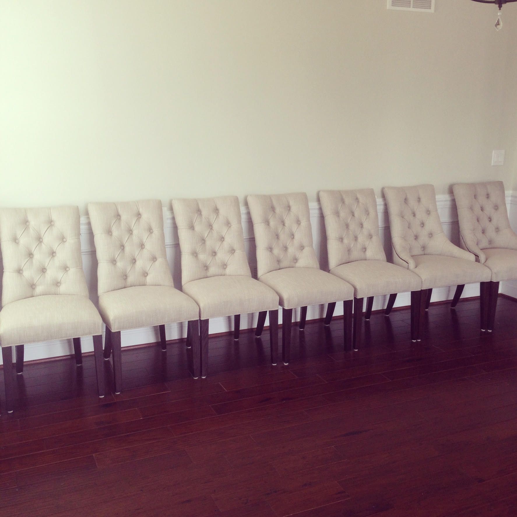 A row of chairs are lined up in a room