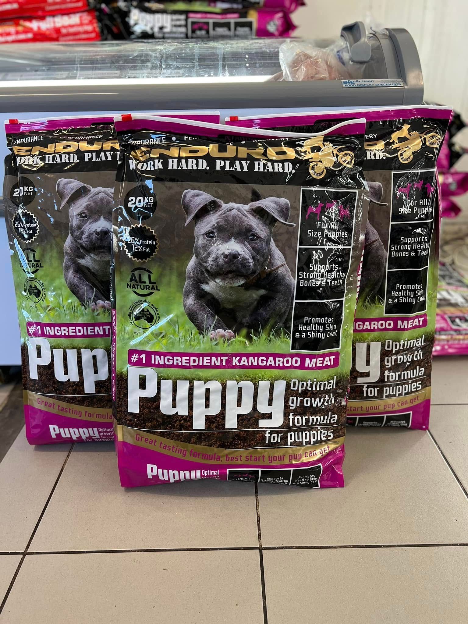 Three Bags of Puppy Food With a Puppy Photo — NQ GAME MEAT in Aitkenvale, QLD