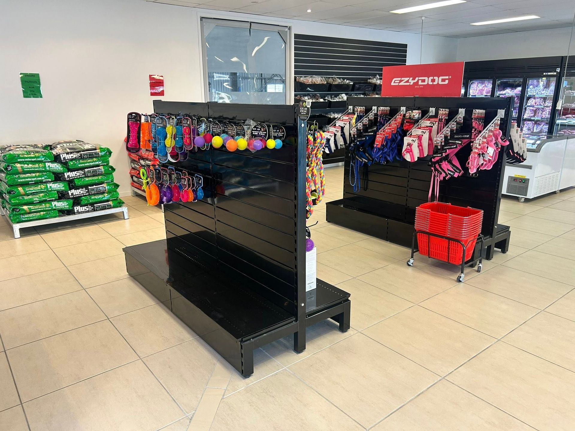 Interior of a Pet Store With Black Display Shelves Holding Pet Accessories — NQ GAME MEAT in Currajong, QLD