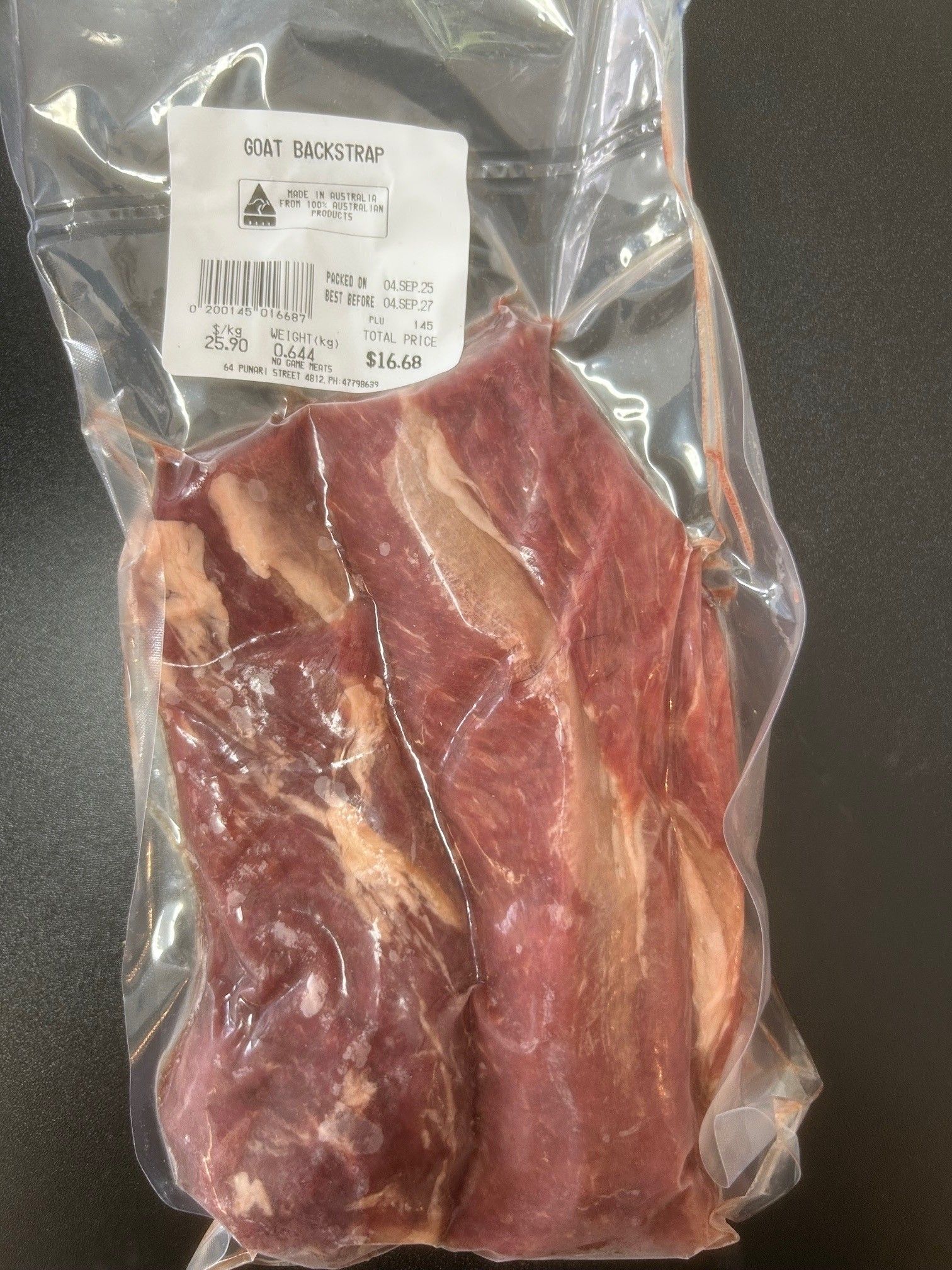Vacuum-sealed package of raw meat; a label is affixed — NQ GAME MEAT in Currajong, QLD 