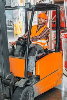 Fork lift operator in safety gear at a Peel, Ontario location.