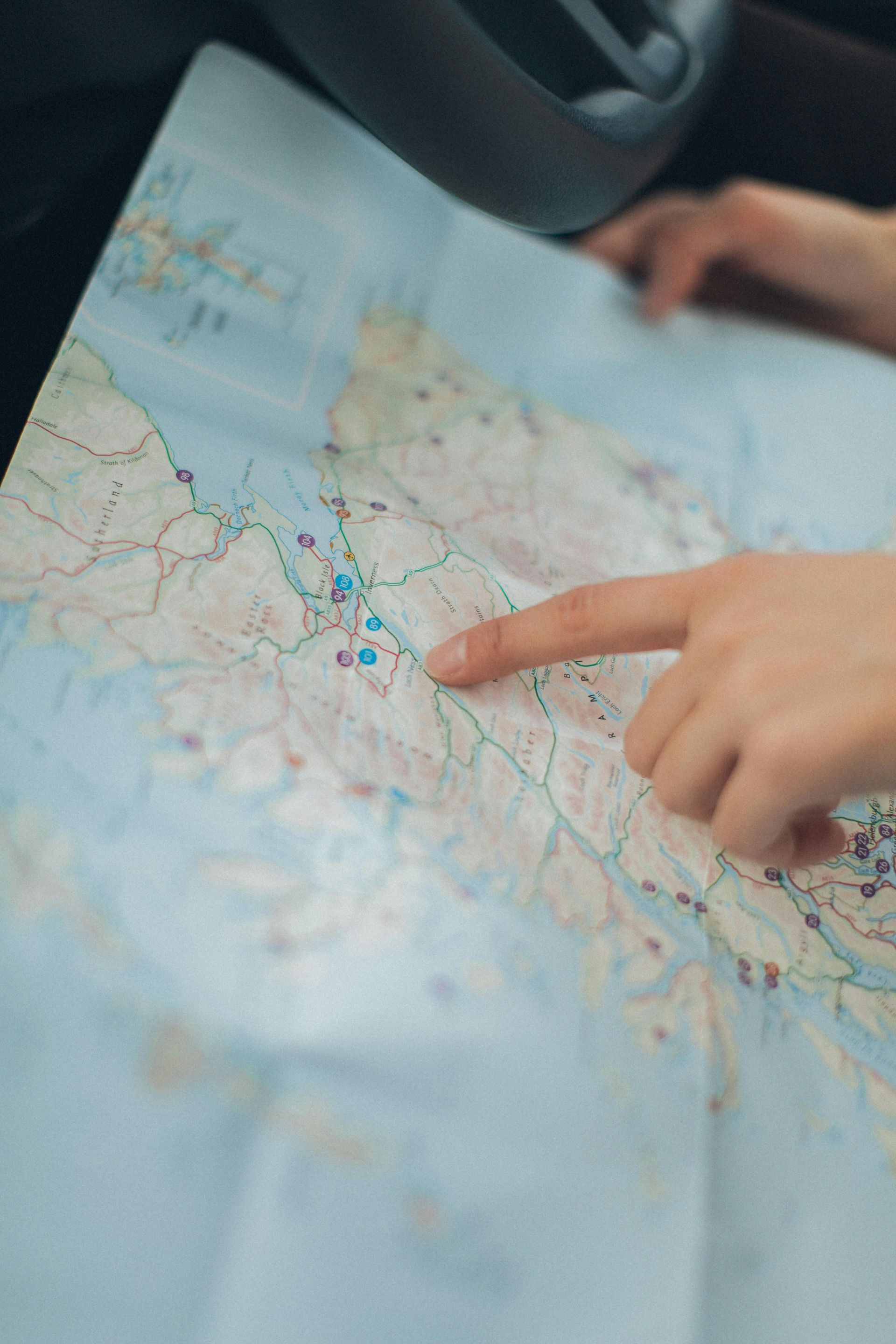 A factory worker looking for a job near them on a map.