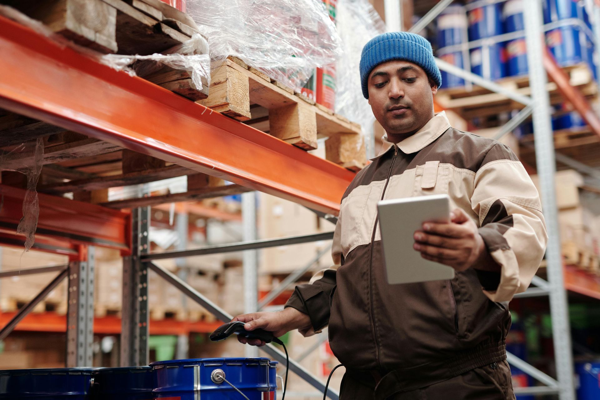 A long-term warehouse associate looking at his list of tasks to complete today.