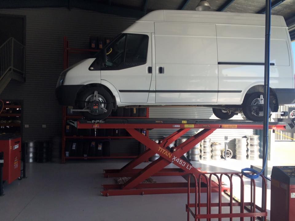 White Van On A Lift — Tyre Master Albury In East Albury, NSW