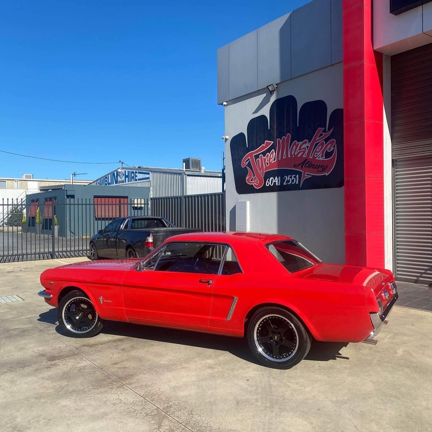 Red Car Parked In Front Of The Shop — Tyre Master Albury In East Albury, NSW