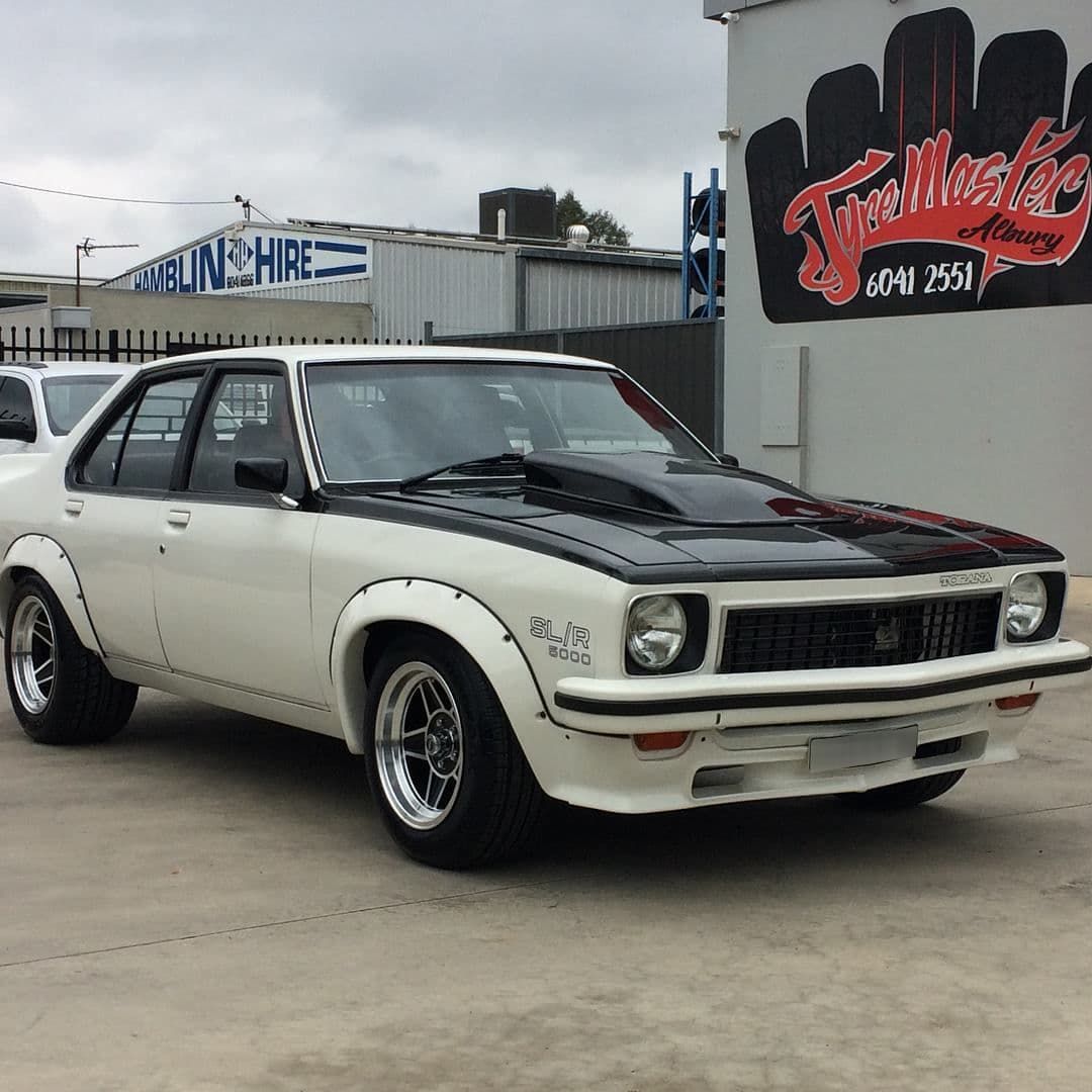 White Car With A Black Hood Parked In Front Of The Shop — Tyre Master Albury In East Albury, NSW
