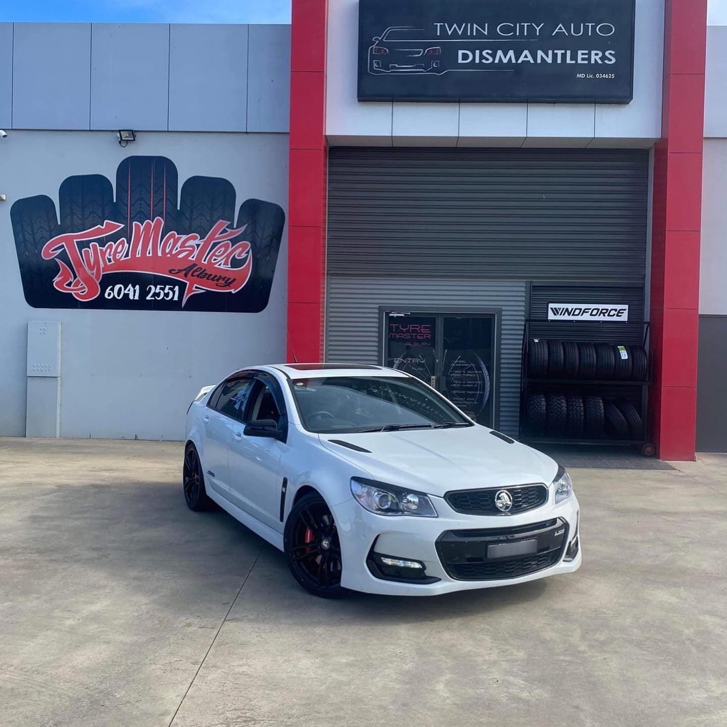 A White Car Parked In Front Of The Shop — Tyre Shop in Albury, NSW