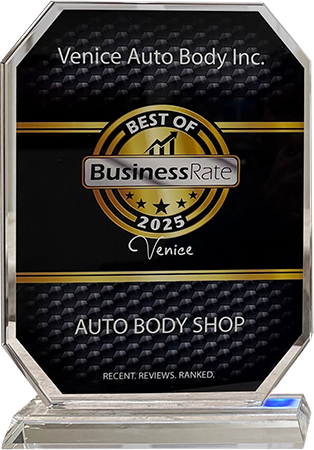 A 2025 Best of BusinessRate award plaque for Venice Auto Body Inc., featuring a gold emblem on a black, patterned background.