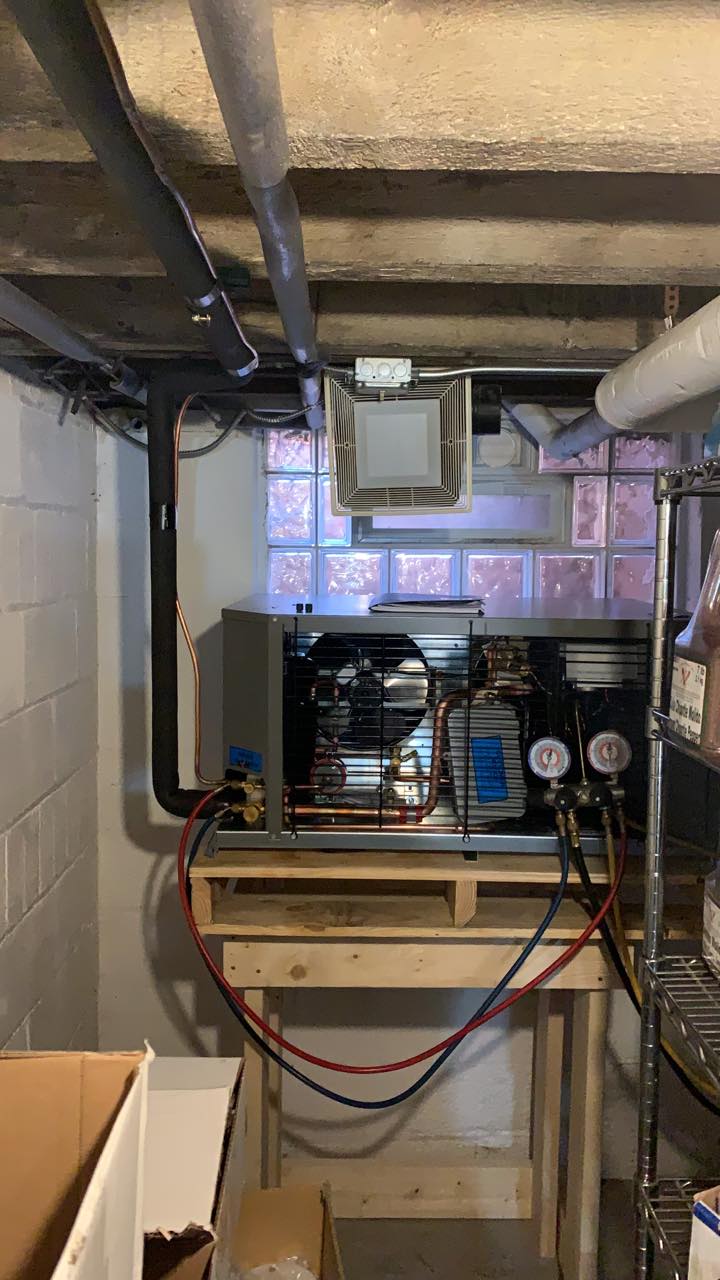 A room with a table and a machine in it.