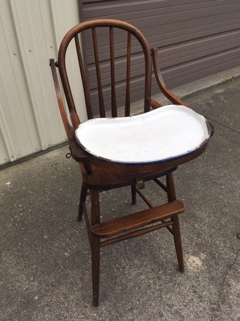 Wooden high chair with white tray; brown wood; vintage.