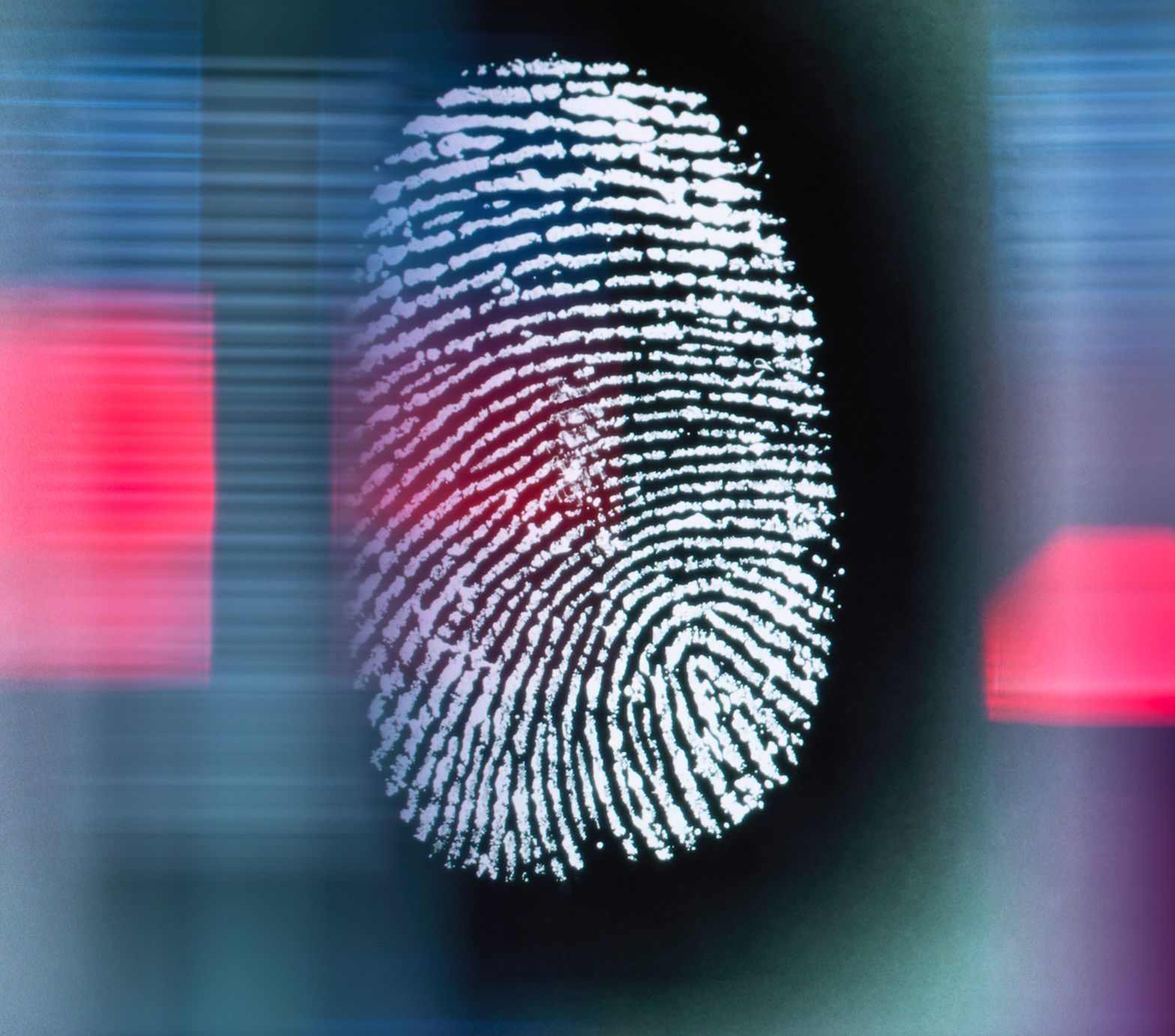 A close up of a fingerprint with a red light in the background