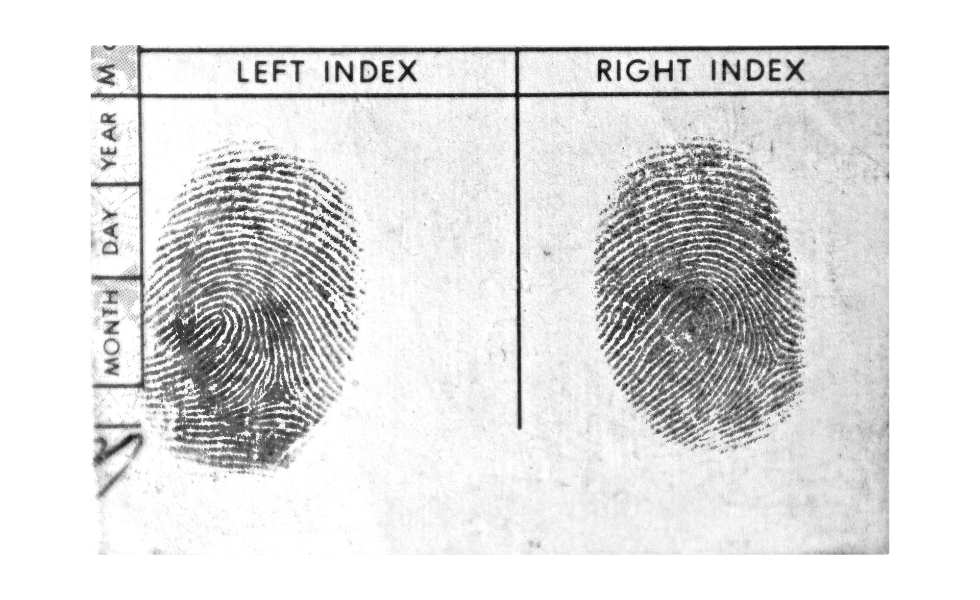 A black and white photo of a fingerprint with the left index and right index