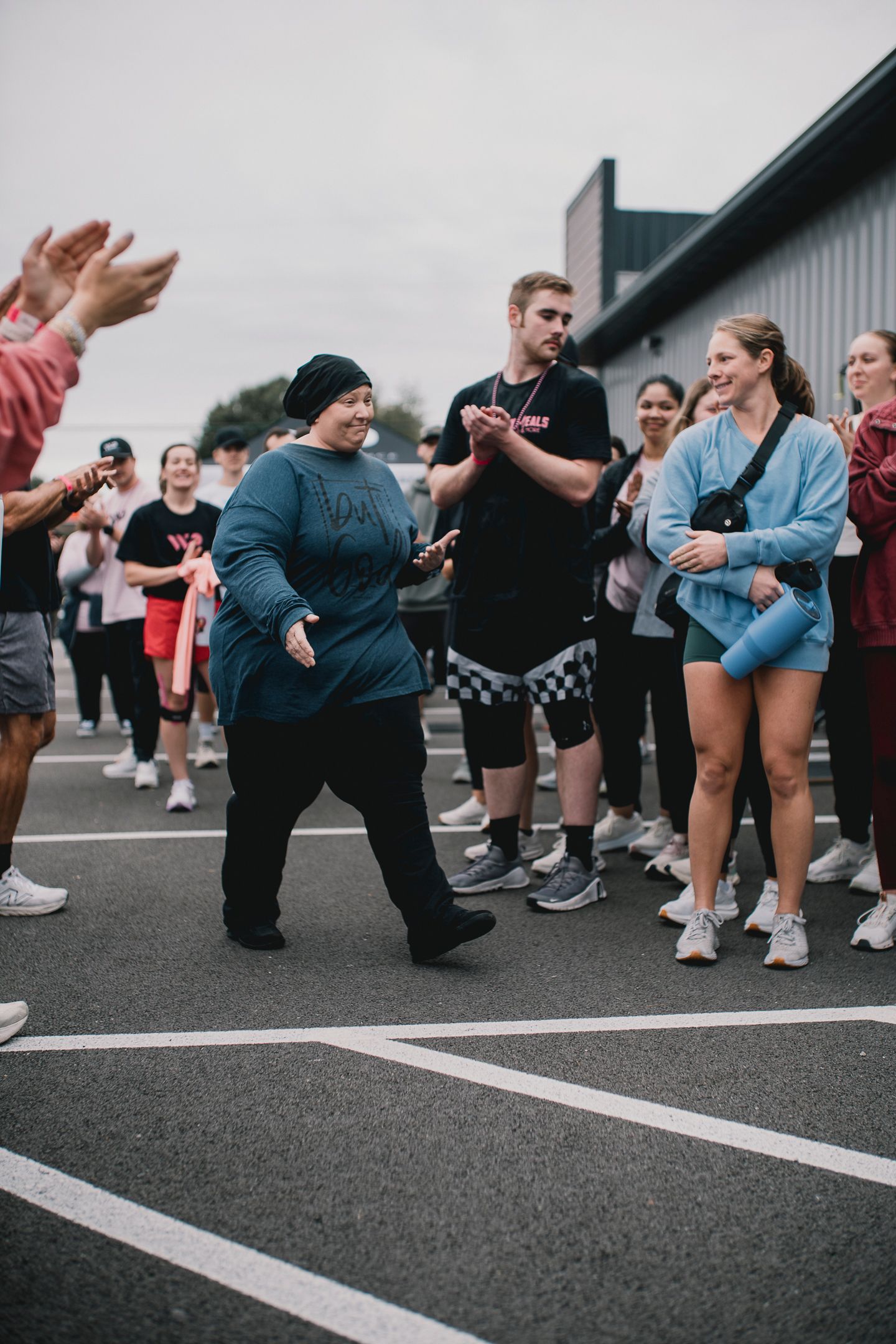 A group of people clapping for a person with cancer. Documentary video production