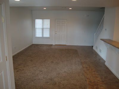 A living room with carpet