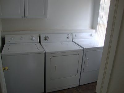 the laundry room with washers and dryers