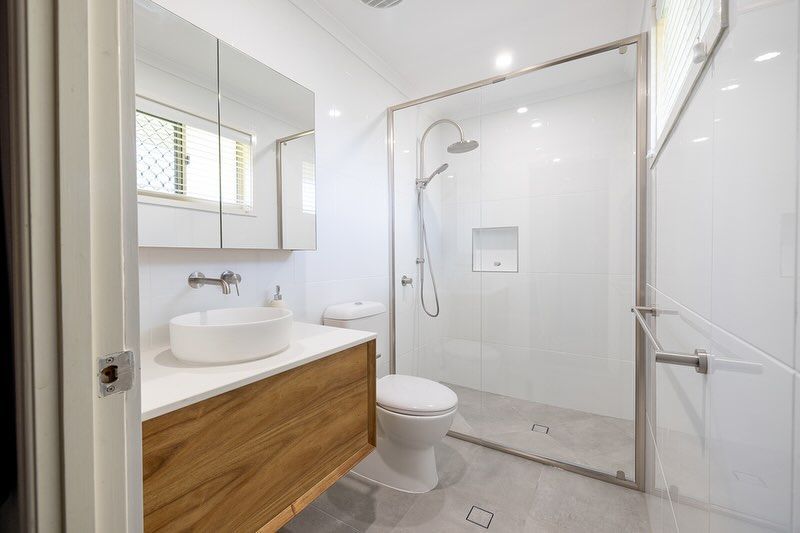 Bathroom With A Toilet, Sink, and Walk-In Shower — Ironbark Built Townsville in Mundingburra, QLD