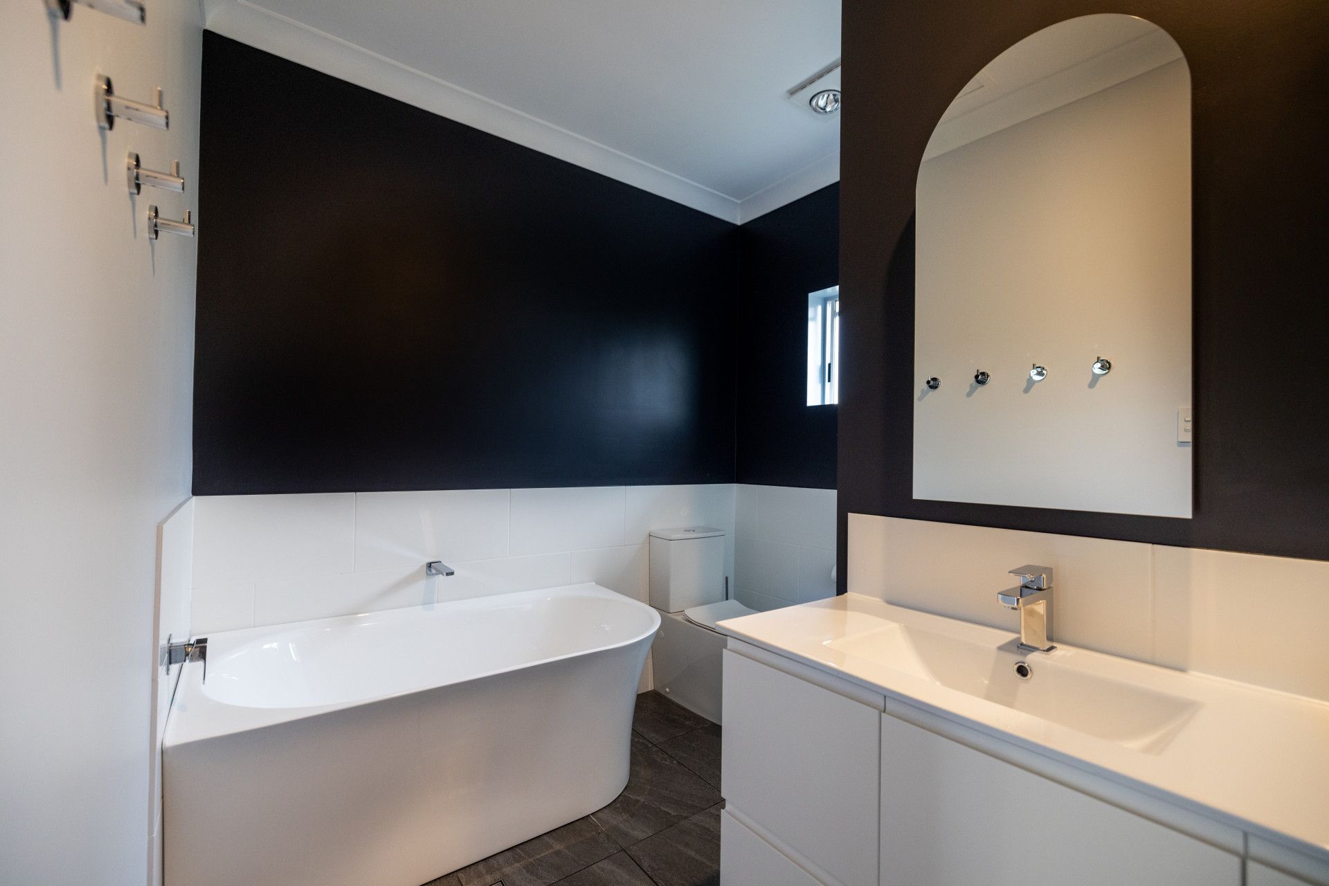 Bathroom With a Bathtub and a Painting on the Wall — Ironbark Built Townsville in Mundingburra, QLD