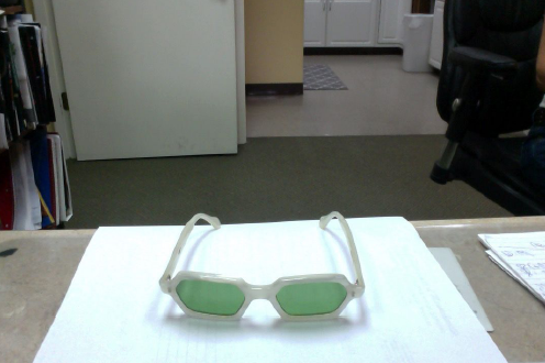 Licensed Optician — White Eyeglass with Green Lens in Peabody, MA