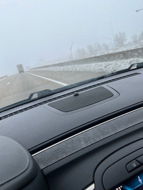 view of foggy road from inside car