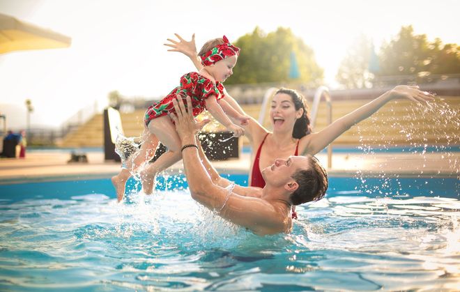 Happy Family on A Swimming Pool — Eagle, CO — Specialized Pool & Spa