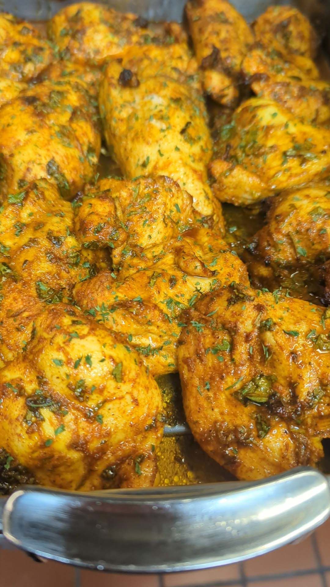 A close up of a plate of food with a spoon in it.