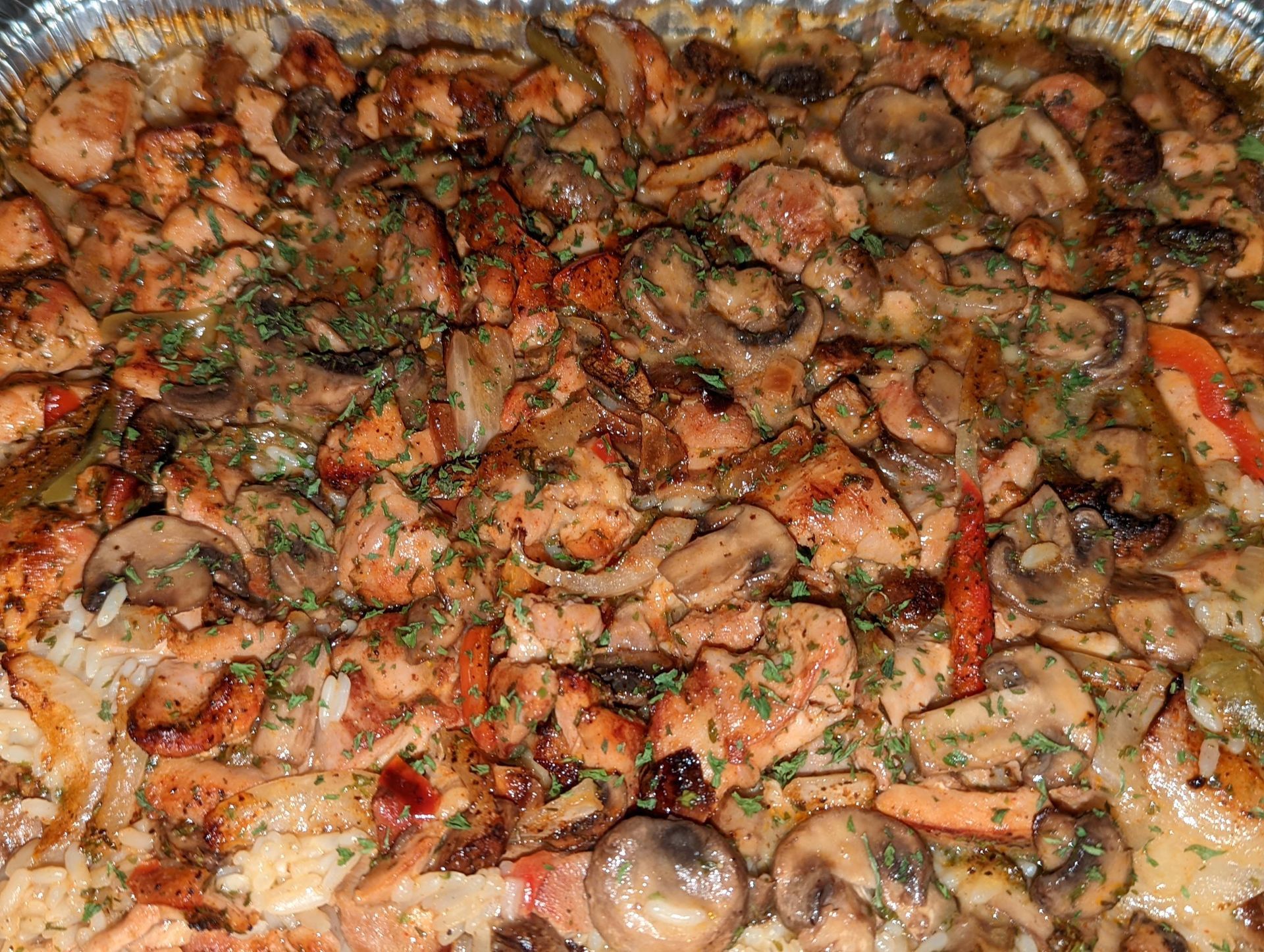 A close up of a plate of food with mushrooms and chicken