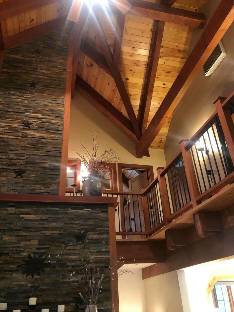 A house with a wooden ceiling and stairs