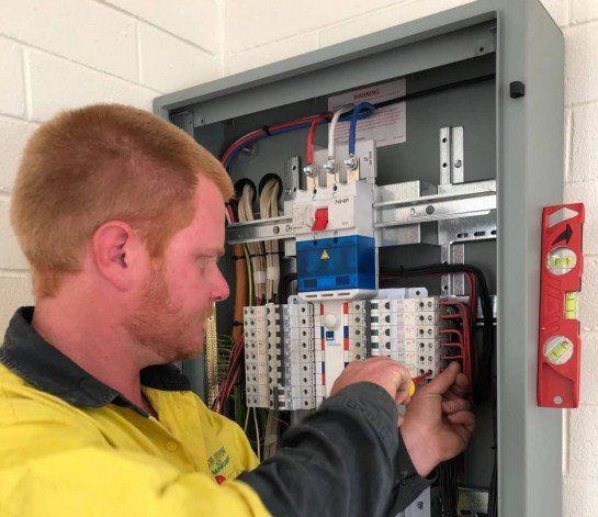 Electrician in Alice Springs fixing switchboard