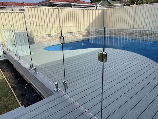 Luxury pool area secured with frameless glass fencing