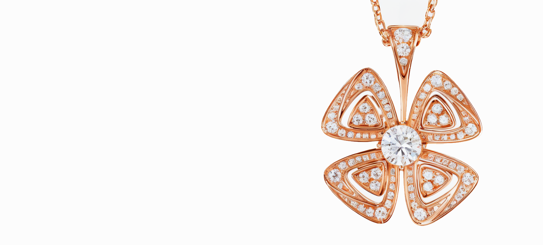 Un collar con un colgante en forma de flor en una cadena.