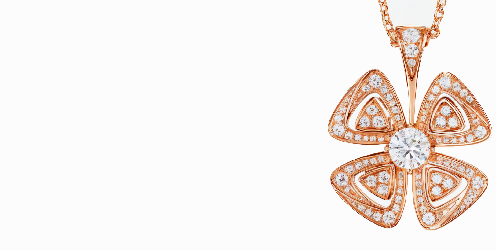 Un collar con un colgante en forma de flor en una cadena.