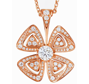 Un collar con un colgante en forma de flor en una cadena.