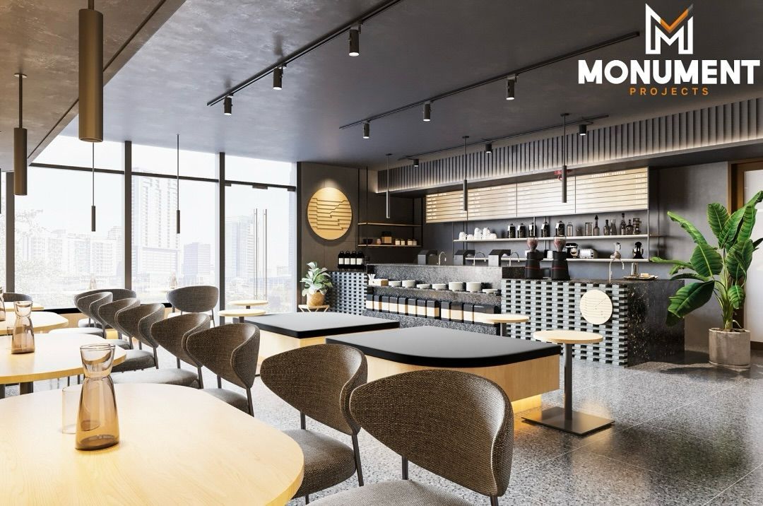 A modern coffee shop interior with light wood tables, curved chairs, track lighting, and a service counter in the back.
