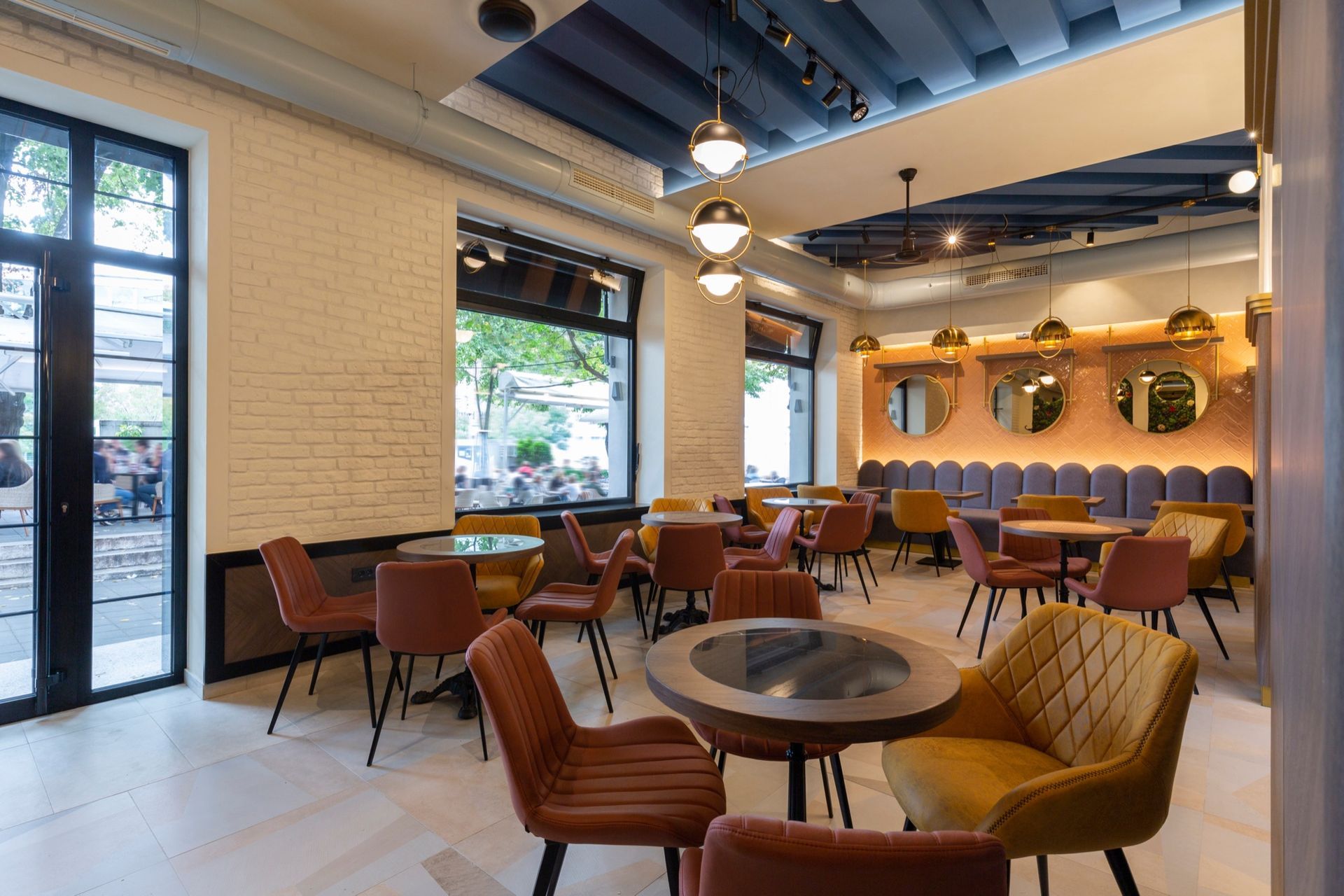 A Modern Office Features a Dark Wood Cabinet, a Sleek Desk with A Computer, an Office Chair, and A Blank Wall Frame.